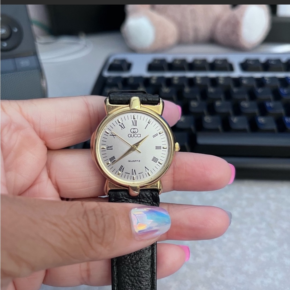 Black and gold vintage Gucci watch